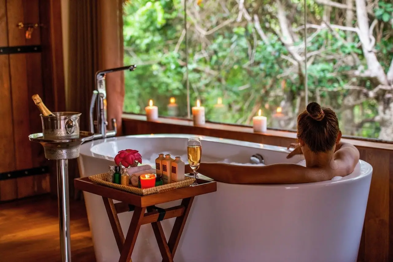 Uga Chena Huts - woman enjoying a bath